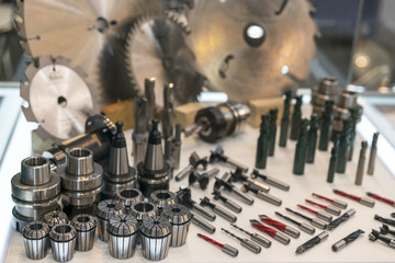 New saws and drills on the stand. New modern industrial drills and mills of the different sizes. Small depth of sharpness