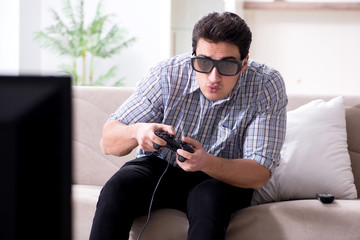 Man playing 3d games at home