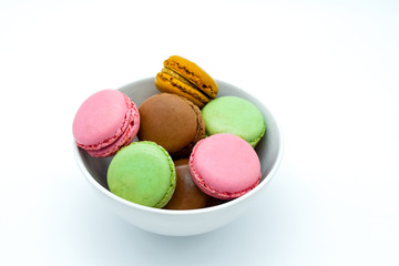 macarons in bowl, sweet colorful macarons on white background
