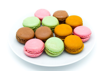 macarons on plate, sweet colorful macarons on white background