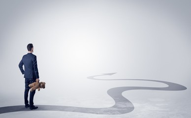 Fototapeta premium Man with object in his hand on the direct way to success