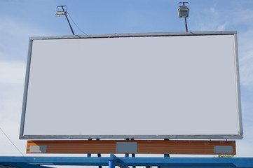 A billboard without inscriptions, empty, on a blue background. Close-up.