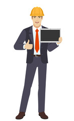 Businessman in construction helmet showing blank digital tablet PC and showing thumb