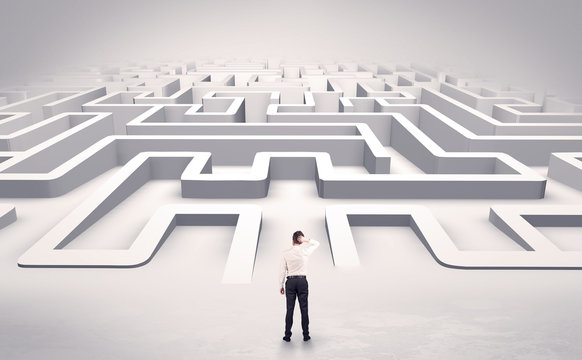 Businessman getting ready to enter a 3D flat labyrinth concept
