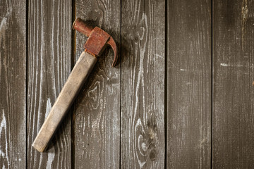 claw hammer on a wooden background