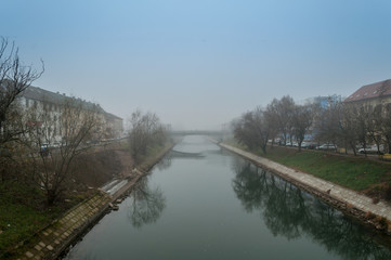 Morning mist over a river. Winter scene.