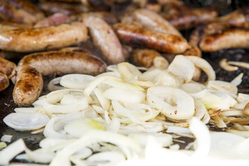Wild Boar Sausage and Onions on grill