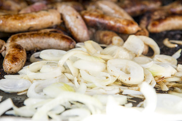 Wild Boar Sausage and Onions on grill