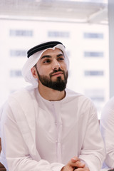 Arabian businessman with kandora portrait in office