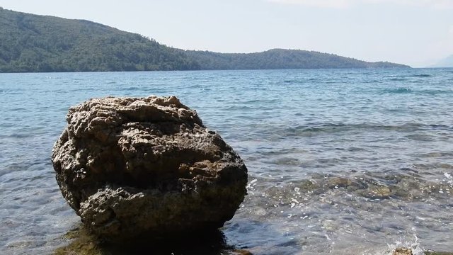 Southern shores of Aegean sea covered with chaos of volcanic tuff, subtropical forest. Very picturesque, shooting with hands
