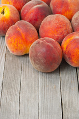 Fototapeta na wymiar Peaches on wooden