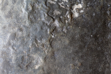 Grey stone texture photo. Natural stone background. Weathered rock relief. Uneven sandstone surface