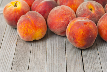 Fototapeta na wymiar Peaches on wooden