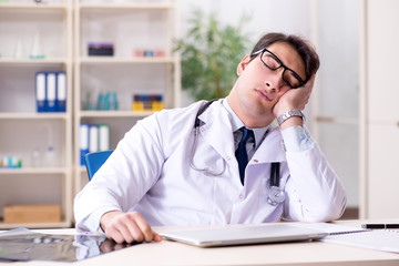 Young doctor sitting in the office