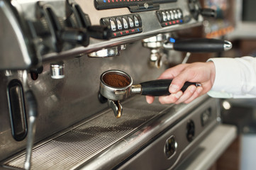 Making espresso and holding the grip right before the espresso is pressed.