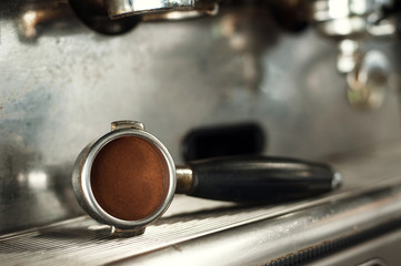 Making espresso and holding the grip right before the espresso is pressed.