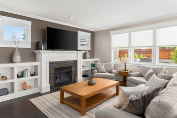 Beautiful Living Room Interior in New Home with Fireplace and Hardwood Floors