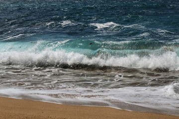 Crystal clear and wild waters in Praia da Foz, Sesimbra, Portugal