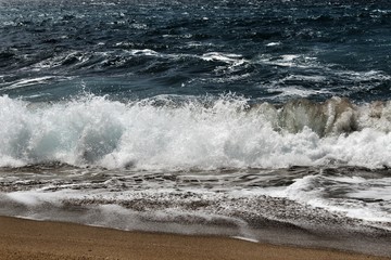 Crystal clear and wild waters in Praia da Foz, Sesimbra, Portugal