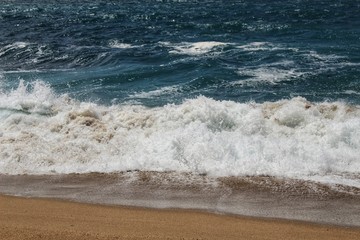 Crystal clear and wild waters in Praia da Foz, Sesimbra, Portugal