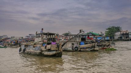 Can Tho, Vietnam - January 14, 2018: Sunrise with boats on the Can Tho floating market river, Mekong Delta, Vietnam