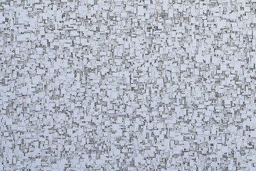 Abstract gray or black and white 3d geometric irregular and randomly placed small cube or box shape tiles background or pattern or sci-fi texture design.