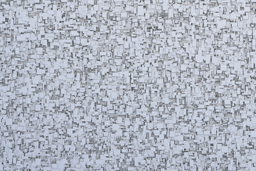 Abstract gray or black and white 3d geometric irregular and randomly placed small cube or box shape tiles background or pattern or sci-fi texture design.