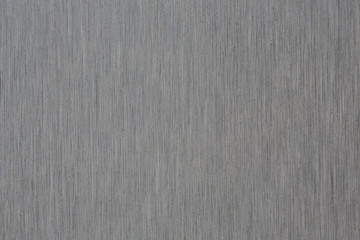 Fototapeta premium Close up industrial background of fractally scratched direct vertical lines to silver metal/stainless steel surface. Creative detail macro photography.