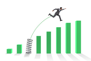 Business people jumping over bar charts