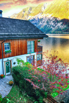 Wooden house on the coast of lake in Hallstatt village Austrian Alps