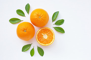 Fresh orange citrus fruit  with leaves on  white wooden background.