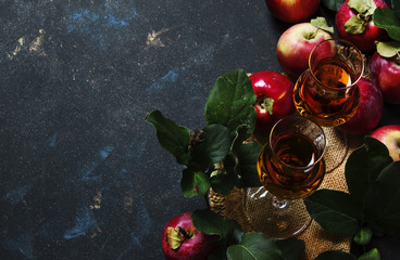 French apple brandy or calvados, dark drink autumn background, top view
