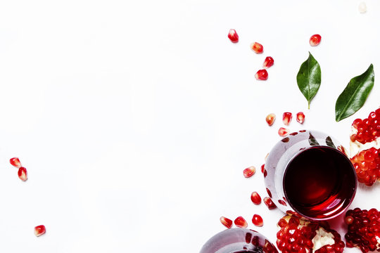 Fresh pomegranate juice in glass on white background, top view