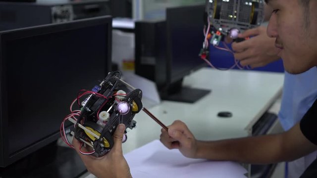 THAILAND -JUNE 1,2018: Unidentified Asian Students creating robotics project of innovation robot model, DIY electronic Kit with laptop together on STEM education in computer classroom school
