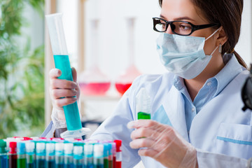Fototapeta premium Female chemist working in hospital lab