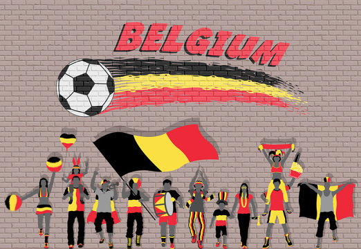 Belgian football fans cheering with Belgium flag colors in front of soccer ball graffiti