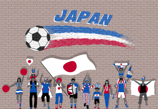 Japanese football fans cheering with Japan flag colors in front of soccer ball graffiti