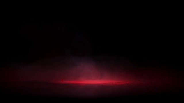 Crime scene blood droplets in light spot cloud fog black background. Red drops in blood puddle