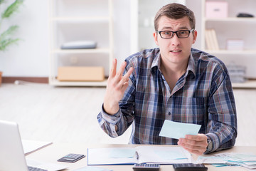 Young man frustrated at his house and tax bills