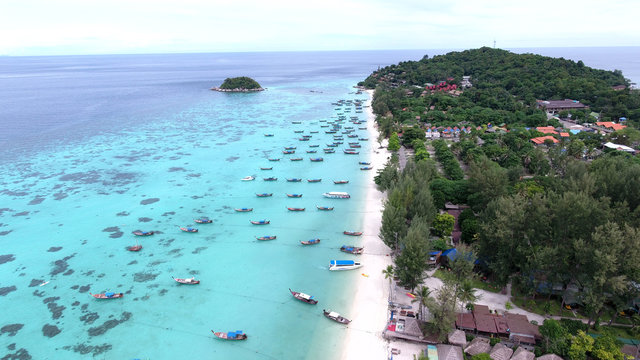 Bird&rsquo;s eye view of tropical beach and rocky coast with crystal clear turquoise water on LiPE island, sunrise beach,Koh Lipe,Thailand