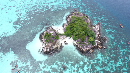 Bird’s eye view of tropical beach with crystal clear turquoise water on 'Koh Kra' island, Koh Lipe,Thailand