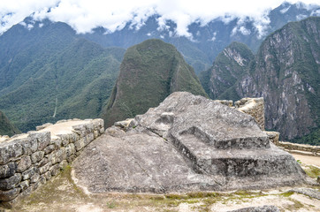 The Intiwatana (or Inti Watana), a ceremonial stone located within the Machu Picchu archaeological site. Cusco, Peru.
