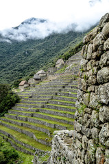 Stone built terracing and buildings at Machu Picchu, an ancient Inca archaeological site near...