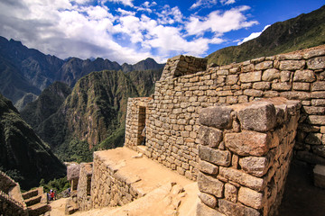 Fototapeta na wymiar Stone built terracing and buildings at Machu Picchu, an ancient Inca archaeological site near Cusco, Peru