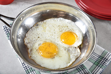Fried eggs in a skillet