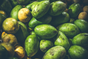 Exotic tropical fruit mang on the night market of Bali island.