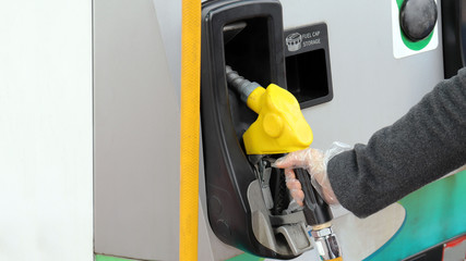 Wear antistatic gloves at gas station.