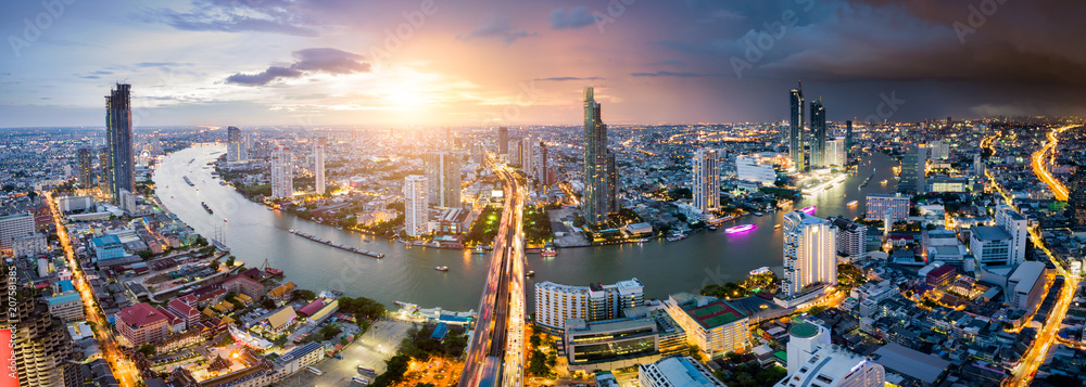 Wall mural aerial view of bangkok skyline and skyscraper with light trails on sathorn road center of business i