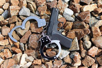 Close-up image of guns and handcuffs.