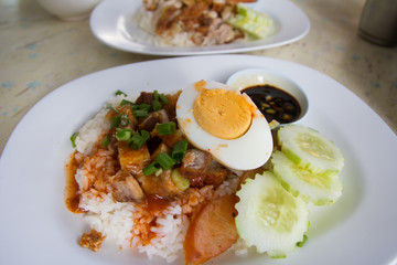 Barbecue pork and roasted pork with stream rice.Thai food